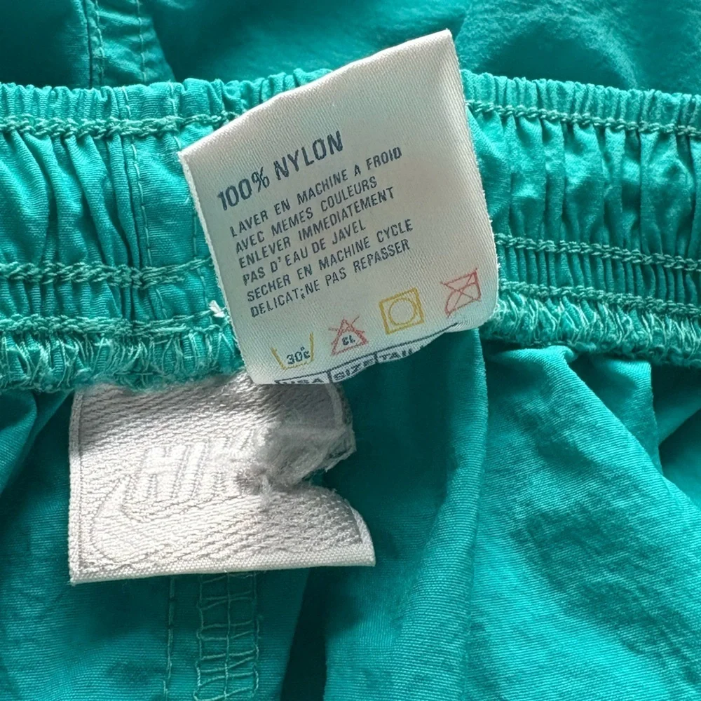 Nike women’s teal nylon short size medium.